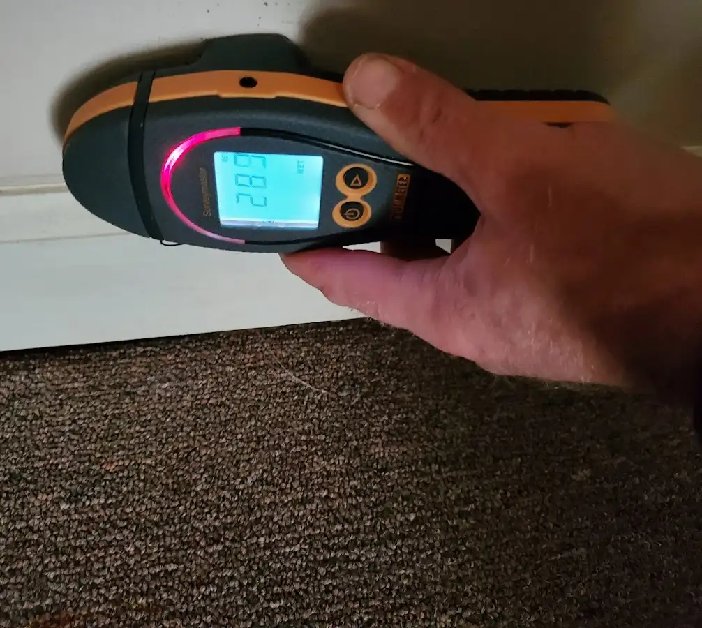 Moisture detection at baseboard during Storm Damage Restoration in Greensburg